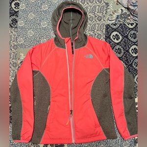 The North Face girls jacket. Medium (10/12). Color is pinky/orange with gray.